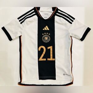 A kids' size Adidas Germany home jersey from the 2022 World Cup